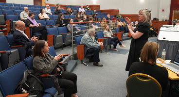Members and friends take part in a presentation during the NFB Law Symposium.